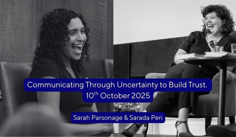 image of Sarah and Sarada sitting on stage laughing.